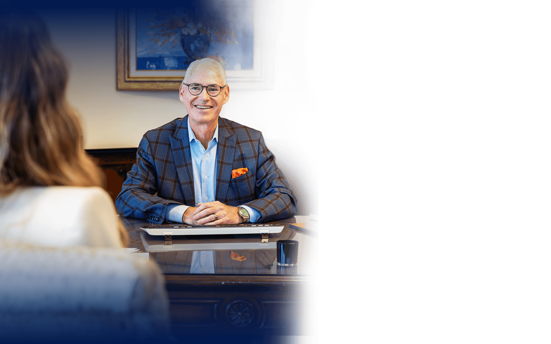 John Foy meeting with a client in his office