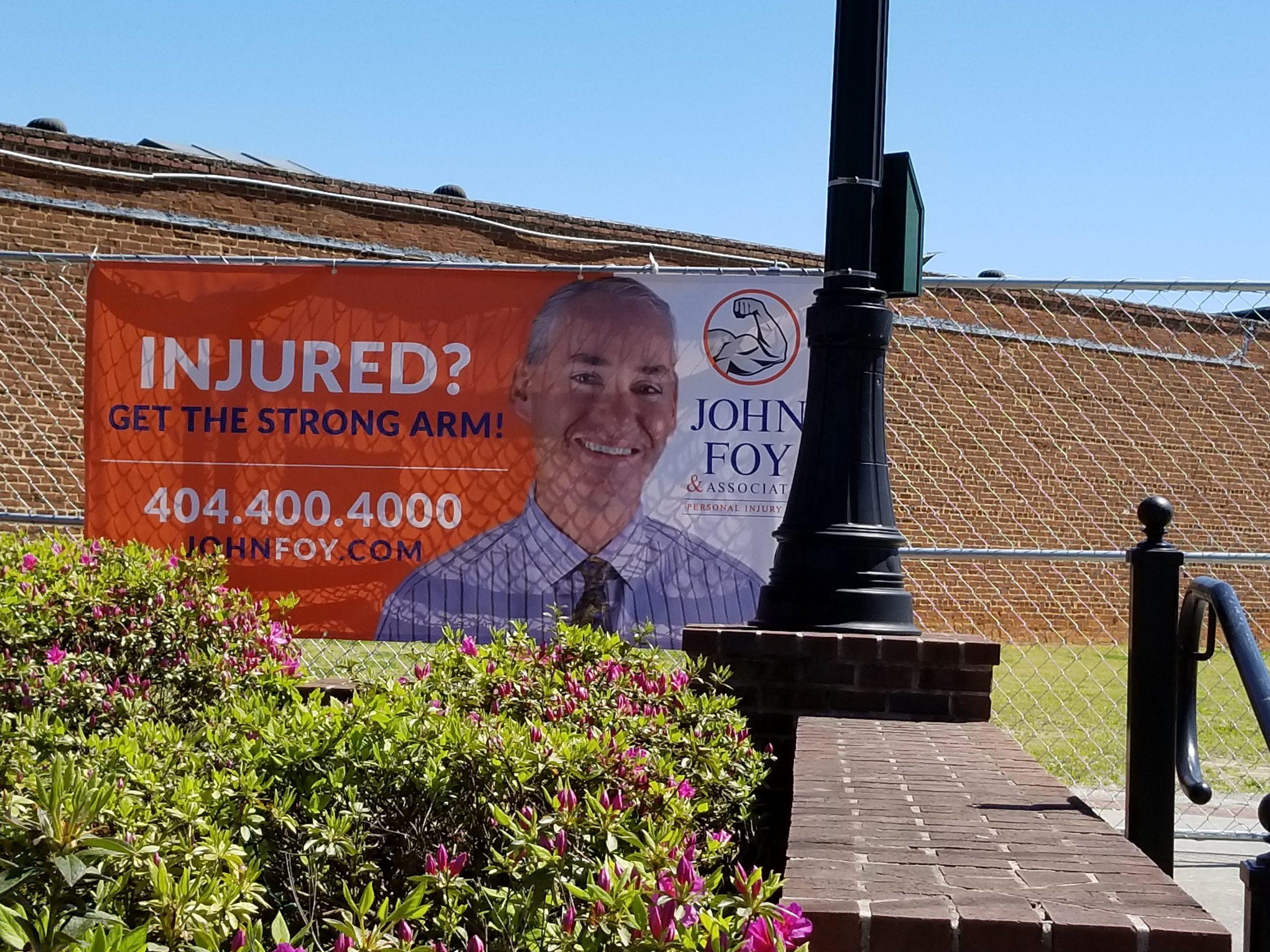 John Foy & Associates Team Up with Rock 100.5 to Help Promote the MuddBuggs & Music Festival. Mudbugs and Music Banners in fence