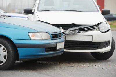 What if the At-Fault Party Doesn't Have Auto Insurance? The front ends of two cars after a crash, which caused one of their drivers to ponder what happens if the at-fault party doesn’t have car insurance.
