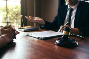 Product Liability Lawyer in Sandy Springs | John Foy & Associates A lawyer explains something to his client.