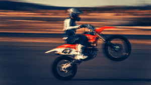 Savannah Negligent Rider Accident Lawyers | Motorcycle Accidents | John Foy & Associates biker popping a wheelie