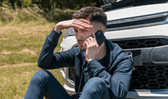boy_calling_broken_down_car