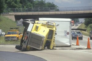 Columbus Big Rig Accident Lawyers | John Foy & Associates overturned big rig by the highway
