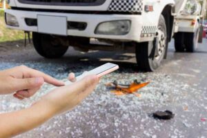 Athens Delivery Truck Accident Lawyers | John Foy & Associates a woman calling for help after a truck accident