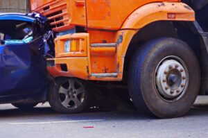 Athens Big Rig Accident Lawyer | We Can Help You File Your Claim A big rig truck rear-ends a smaller passenger vehicle on the road.