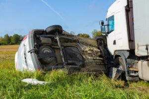 Athens Cargo Truck Accident Lawyer | Get Your Free Consultation Today A cargo truck crashed into another passenger vehicle causing it to roll over on the side of the road.