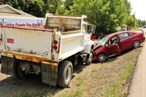 Athens Construction Truck Accident Lawyer | 24/7 Support Available The aftermath of a head-on collision involving a passenger vehicle and a construction dump truck.