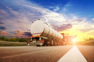 Athens Fuel Truck Accident Lawyer | Free Consultations | No Fees Upfront A large tanker truck drives on the open road.