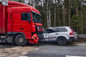 Athens Tractor-Trailer Accident Lawyer | No Upfront or Hidden Fees A large red truck crashes head-on into a passenger vehicle.