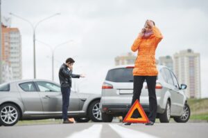 Athens Food Delivery Car Accident Lawyers | John Foy | Call Today two frustrated people on their phones after car accident