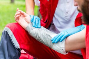 Burn Injury Lawyer in Sandy Springs | John Foy & Associates A medical worker treats a man’s burned arm.