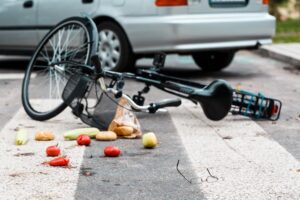 Sandy Springs Bicycle Accident Lawyers | John Foy & Associates bike lying in street after being struck by car