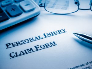 blank personal injury claim form on table