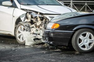 Stonecrest Car Accident Lawyer | Free Consultations Available A car crash between two cars on the street.