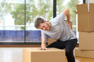Workers' Compensation Lawyer in Macon, GA | John Foy man suffers back injury while lifting boxes at work