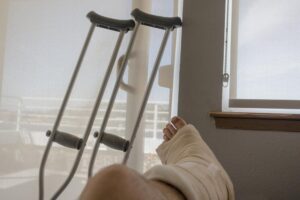 Union City Personal Injury Lawyers | John Foy & Associates patient with injured leg lies near crutches