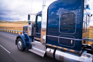 Austell Truck Accident Lawyers | John Foy & Associates side view of semi-truck on highway