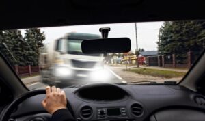 Sandy Springs Truck Accident Lawyer | No Fees Upfront A large truck is about to crash head on into a car.
