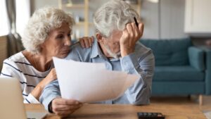 SSDI Lawyer in Union City, GA | John Foy & Associates An elderly couple worries over paperwork.