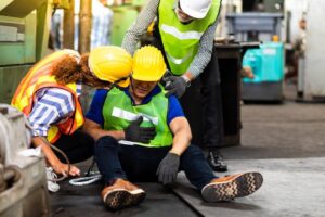 Smyrna Workers' Compensation Lawyer | Free Consultation Workers help their injured colleague after an injury.
