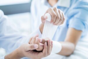 Dog Bite Lawyer in Dawsonville, GA | John Foy & Associates doctor bandaging patient’s arm