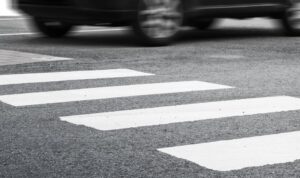 car speeding into crosswalk