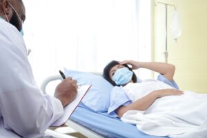 Catastrophic Injury Lawyer in College Park | 24/7 Support doctor taking a female patient’s vitals