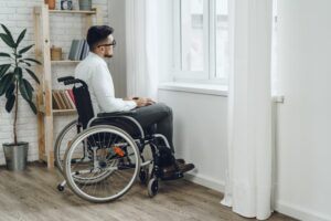 Catastrophic Injury Lawyer in Columbus | Free Consultations man sitting in a wheelchair by the window
