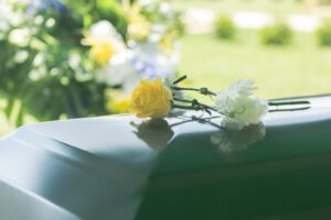Wrongful Death Lawyer in Austell | 24/7 Support roses on a casket