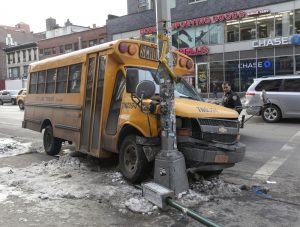 school bus wrapped around a pole