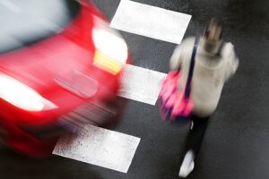 College Park Pedestrian Accident Lawyers | John Foy | Call 24/7 blurred image of imminent crosswalk accident