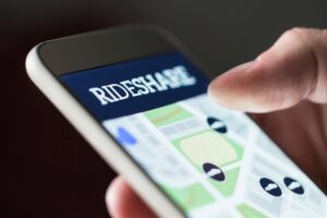 Jonesboro Rideshare Accident Lawyers | 24/7 Support close-up on someone using a rideshare app