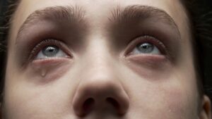 Albany Wrongful Death Lawyers | John Foy & Associates closeup of grieving woman crying