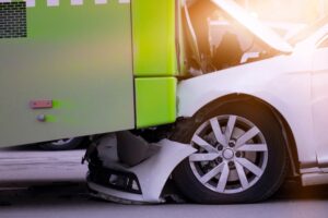 Bus Accident Lawyer in Mableton | Free Consultations compact car crushed under a bus