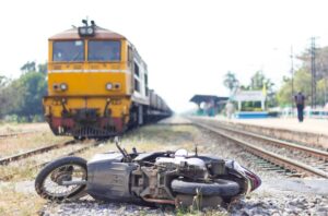 Motorcycle Accident Lawyer in Roswell | 24/7 Support crashed motorcycle on railroad tracks