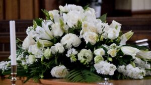 Wrongful Death Lawyer in Hampton | 24/7 Support funeral flower spray on a coffin