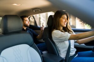 Decatur Uber Accident Lawyers | Free Consultations male passenger with female Uber driver