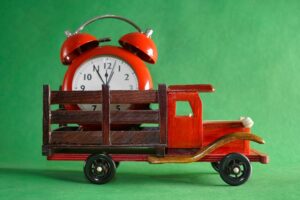 model truck with alarm clock in its bed