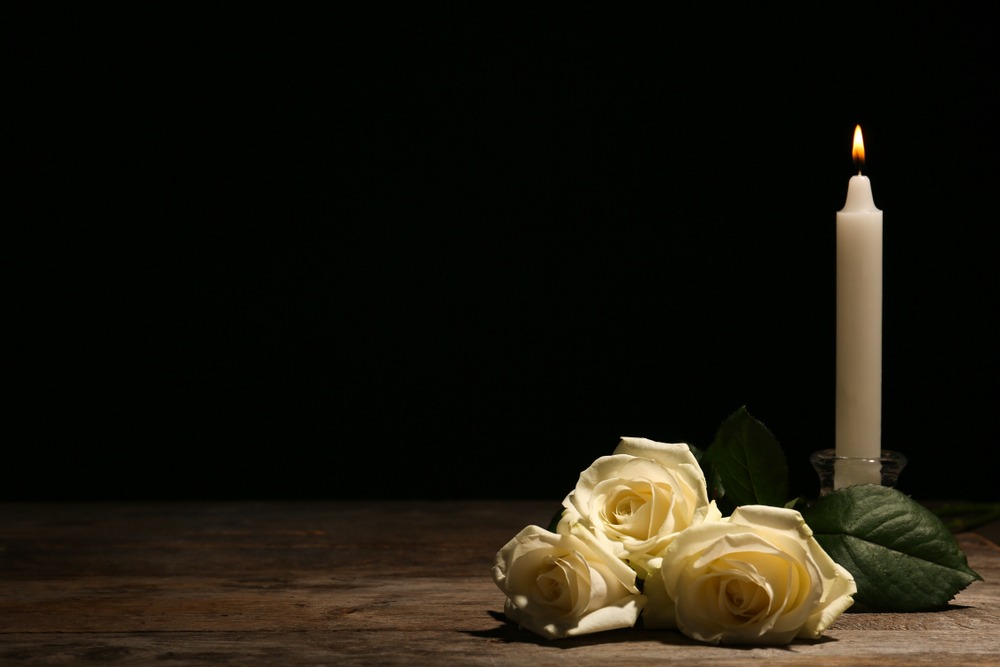 Fatal Car Accident Lawyer in Atlanta - White Roses And Candle On Table