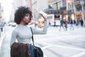Rideshare Accident Lawyer in Newnan | 24/7 Support woman hailing a rideshare