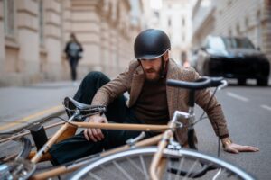 Bicycle Accident Lawyer in College Park | Free Consults bicycle accident victim in the road