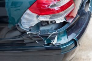 Rideshare Accident Lawyer in Carrollton | John Foy | Call 24/7 cracked rear bumper