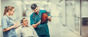 Traumatic Brain Injury Lawyer in Stone Mountain | John Foy injured man looks at brain scans