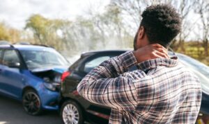 Uninsured Motorist Accident Lawyer in Riverdale car accident with stressed man