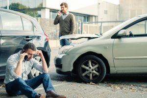 men calling for help after an accident
