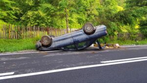 Filing A Wrongful Death Lawsuit In Sandy Springs For A Fatal Car Accident overturned blue car on the road