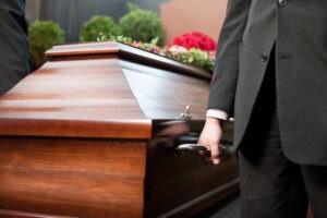 Ellenwood Wrongful Death Lawyer | John Foy pallbearer carrying coffin