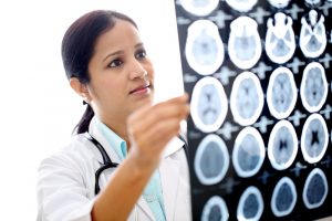 female doctor examining brain
