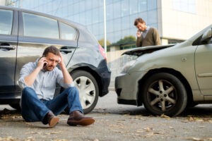 Uber Accident Lawyer in Acworth | Free Consults two men calling for help after car wreck