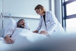 Catastrophic Injuries Lawyers in Dallas | Free Consults doctor tending to hospitalized patient